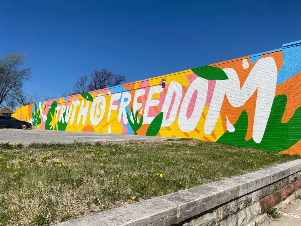 Mural at Ruby Jean's Juicery that says "Truth is Freedom"